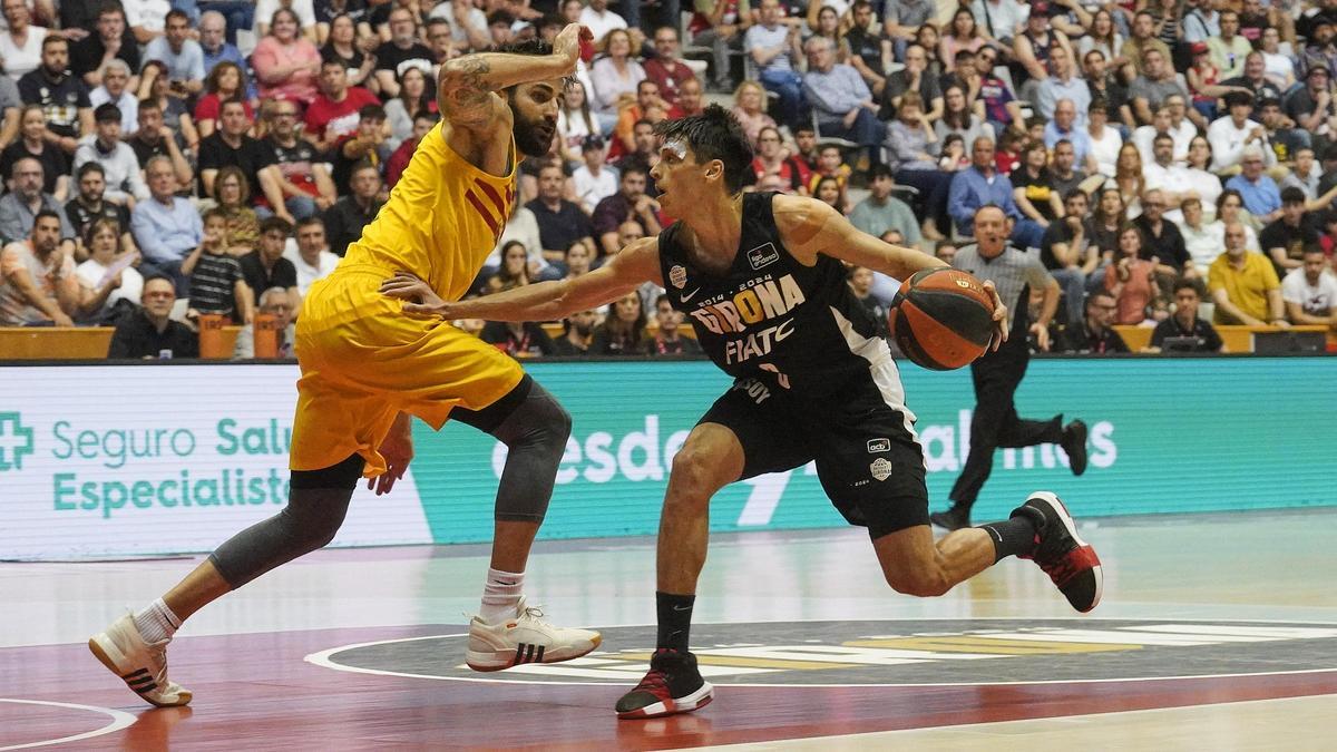 Rubio defensa Marcos en el partit a Fontajau contra el Bàsquet Girona