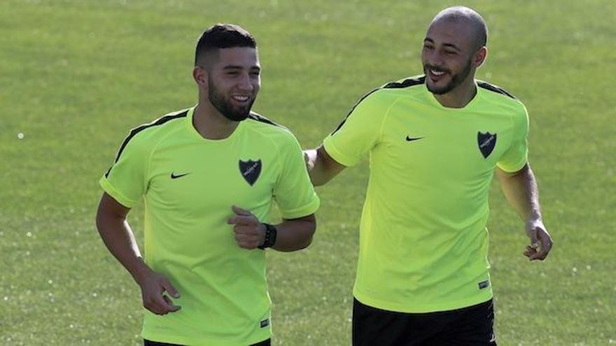 Adnane Tighadouini y Nordin Amraba durante el entrenamiento de esta mañana.