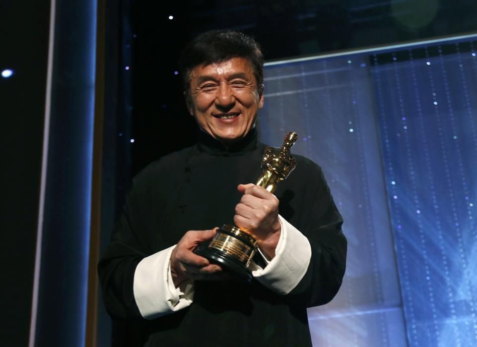 Actor Jackie Chan poses with his Honorary Award ...