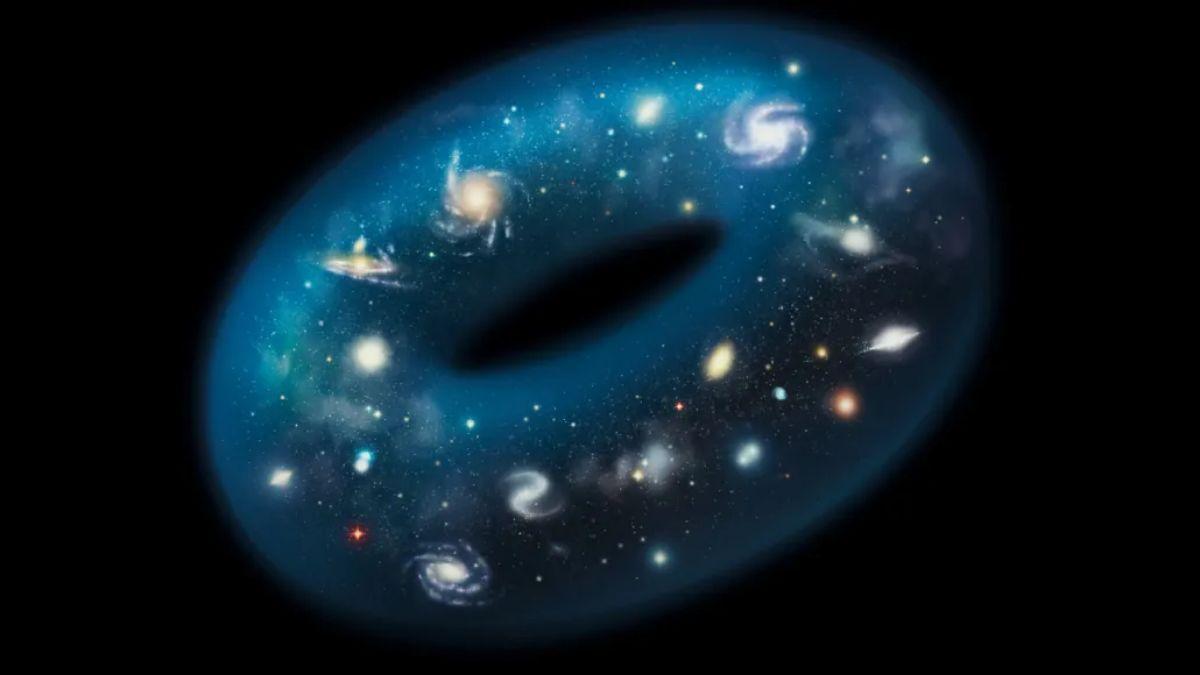 Los científicos están considerando que el Universo podría tener una topología complicada, representada por una forma de rosquilla o dónut en esta recreación artística.