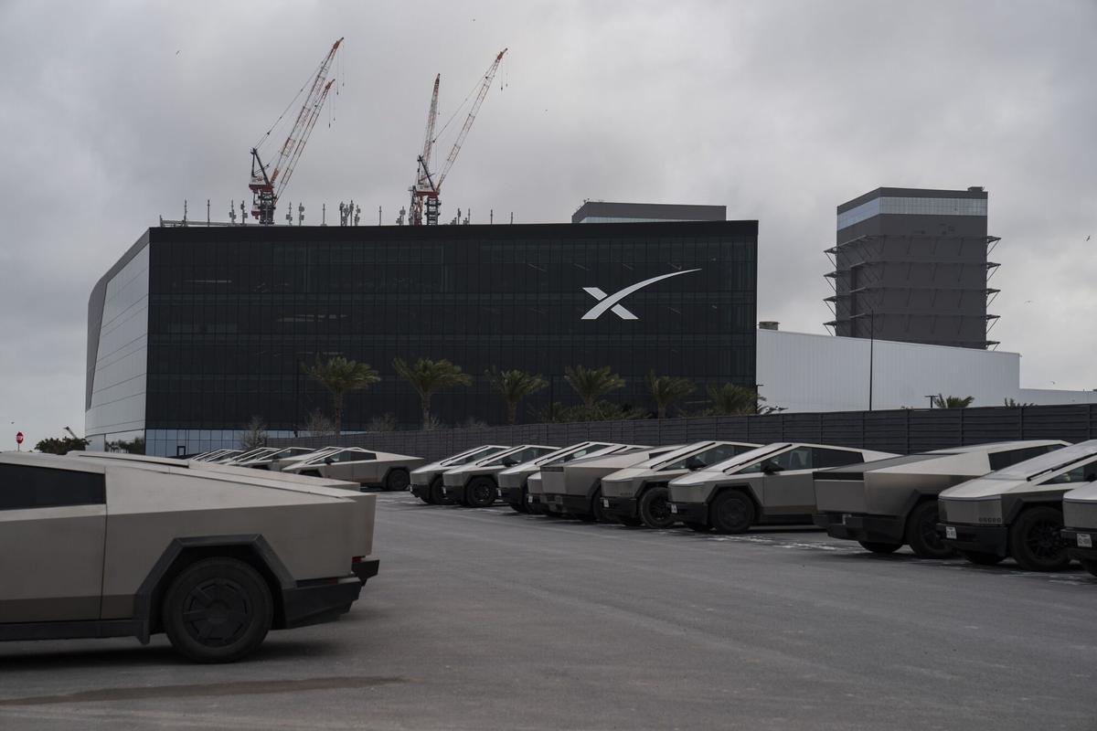 Tesla Cybertruck vehicles parked at the SpaceX Starbase industrial complex and rocket launch facility in Starbase, Texas, US, on Thursday April 30, 2026. SpaceX's spaceport put Brownsville on the map, but locals fear being priced out by newly rich neighbors. Photographer: Gabriel V. Cardenas/Bloomberg