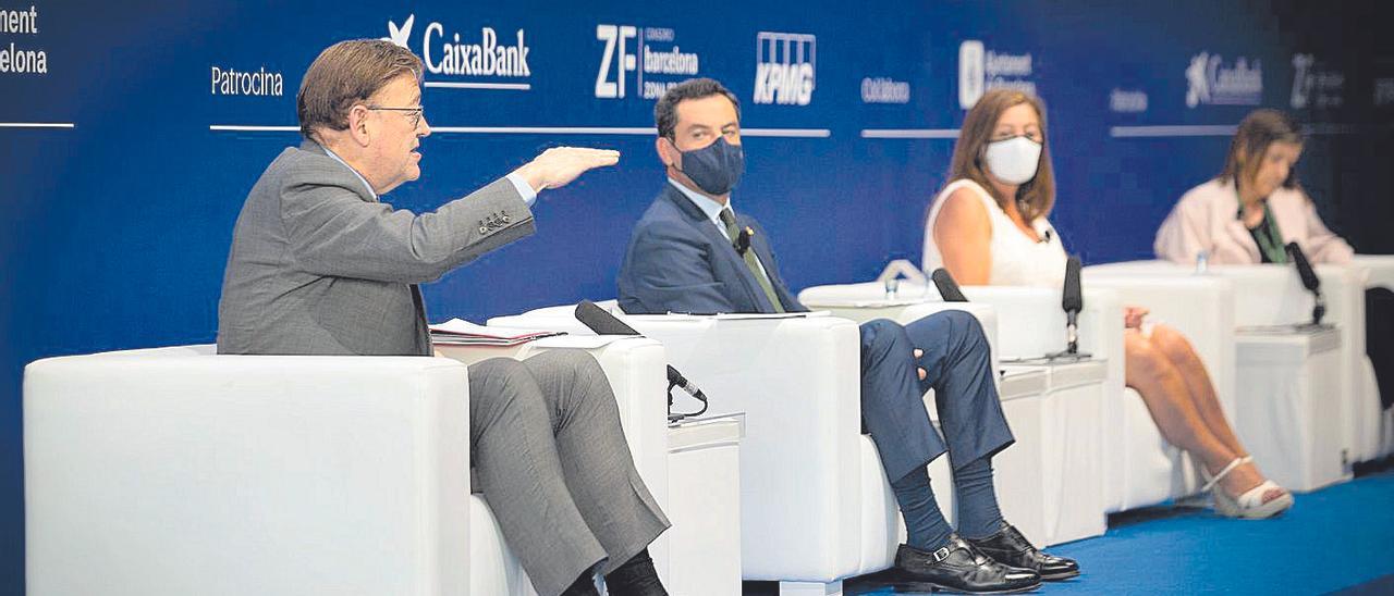 Puig, Moreno Bonilla y Francina Armengol, en un debate en Barcelona en junio.