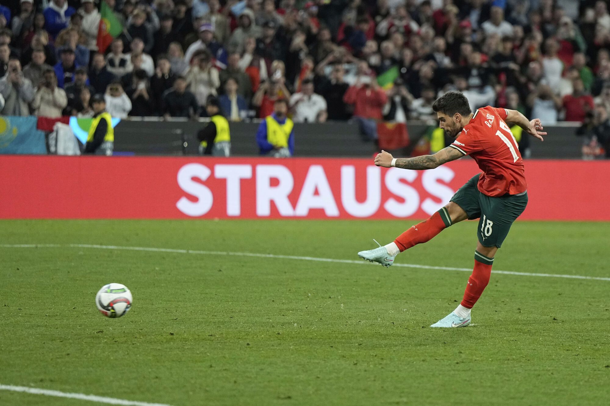 Portugal's Ruben Neves scores the penalty shootout during the Nations League final soccer match between Portugal and Spain at the Allianz Arena in Munich, Germany, Sunday, June 8, 2025. (AP Photo/Martin Meissner)