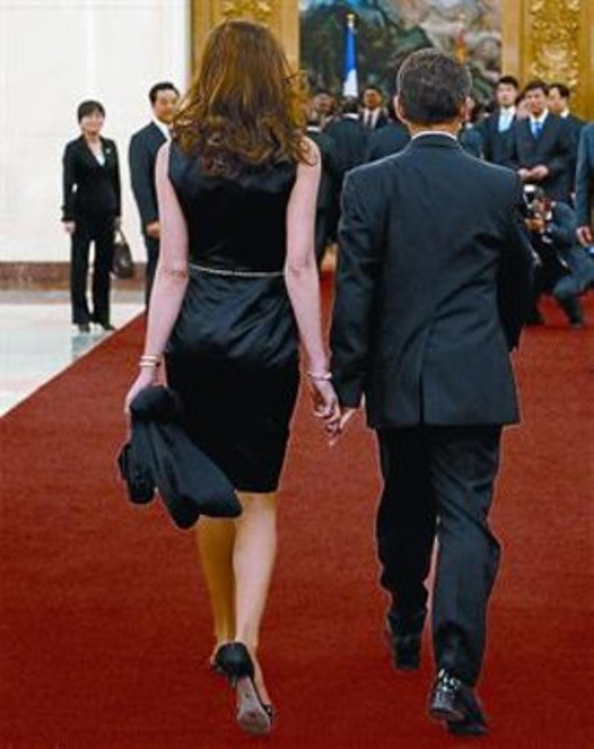 Carla Bruni i Nicolas Sarkozy, ahir, en una recepció oficial a Pequín. Carla Bruni i Nicolas Sarkozy, ahir, en una recepció oficial a Pequín.