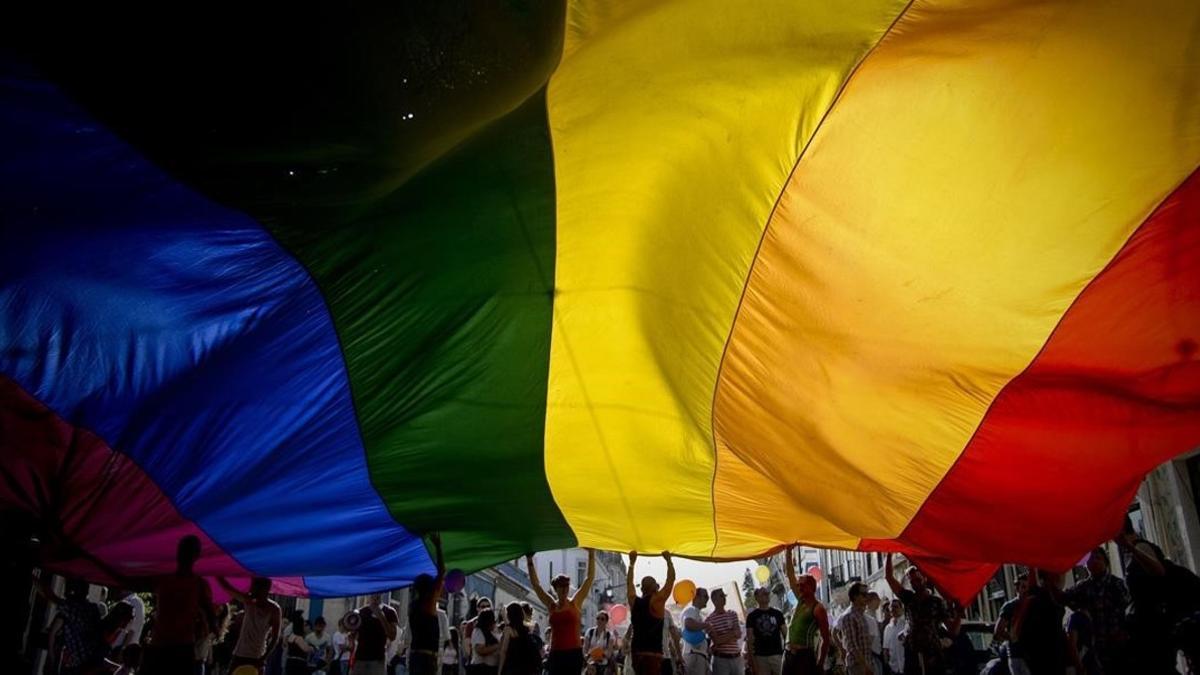 lmmarco22812167 people wave a giant rainbow flag during the gay pride parade170609201029