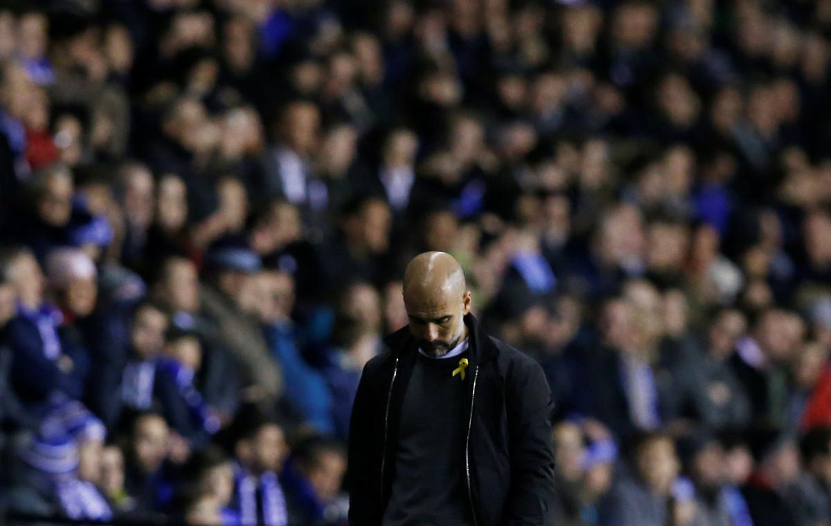 Soccer Football - FA Cup Fifth Round - Wigan Athletic vs Manchester City - DW Stadium, Wigan, Britain - February 19, 2018   Manchester City manager Pep Guardiola looks dejected    REUTERS/Andrew Yates