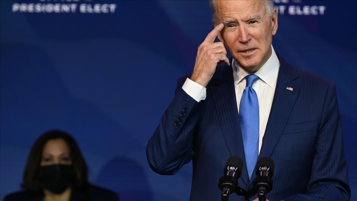 US President-elect Joe Biden  with Vice President-elect Kamala Harris (L)  speaks about the Covid-19 crisis before introducing nominees to his incoming administration on December 11  2020  in Wilmington  Delaware  - Biden is nominating Tom Vilsack to be Agriculture Secretary  US Representative Marcia Fudge to be Housing and Urban Development Secretary  Denis McDonough to be Veterans Affairs Secretary  Katherine Tai to be Trade Representative  and Susan Rice to be Director of the White House Domestic Policy Council  (Photo by Jim WATSON   AFP)