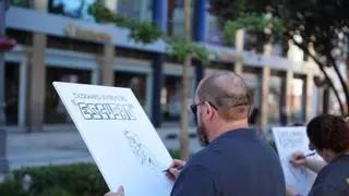 Diccionario extremeño a golpe de pincel: el cómic gigante en vivo toma el paseo de San Francisco en Badajoz