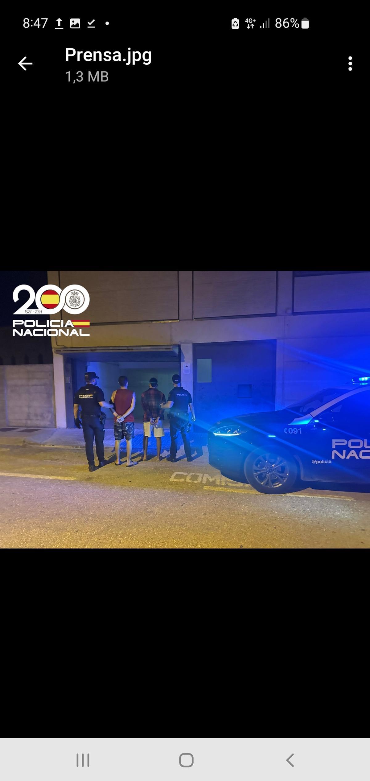 Dos de los acusados, al ser detenidos.