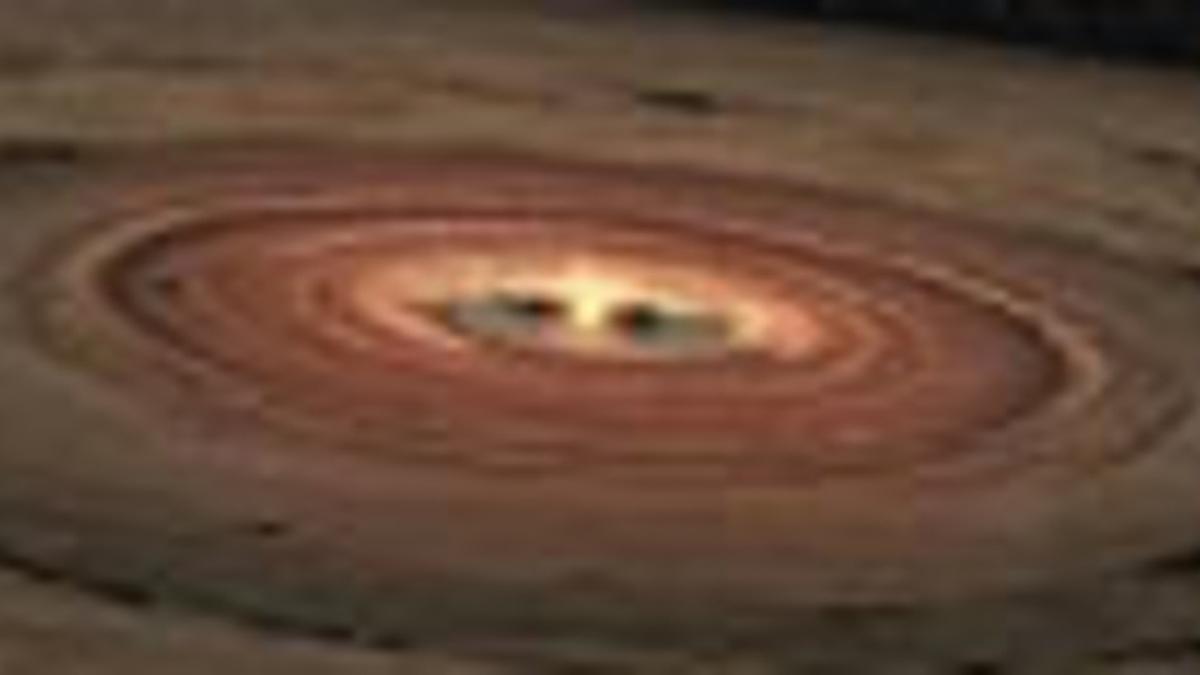 Simulación de una joven estrella envuelta en un círculo de gases y polvo.