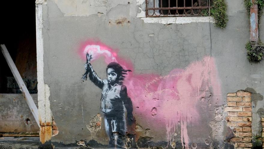 El grafiti de Banksy en una pared de Venecia.