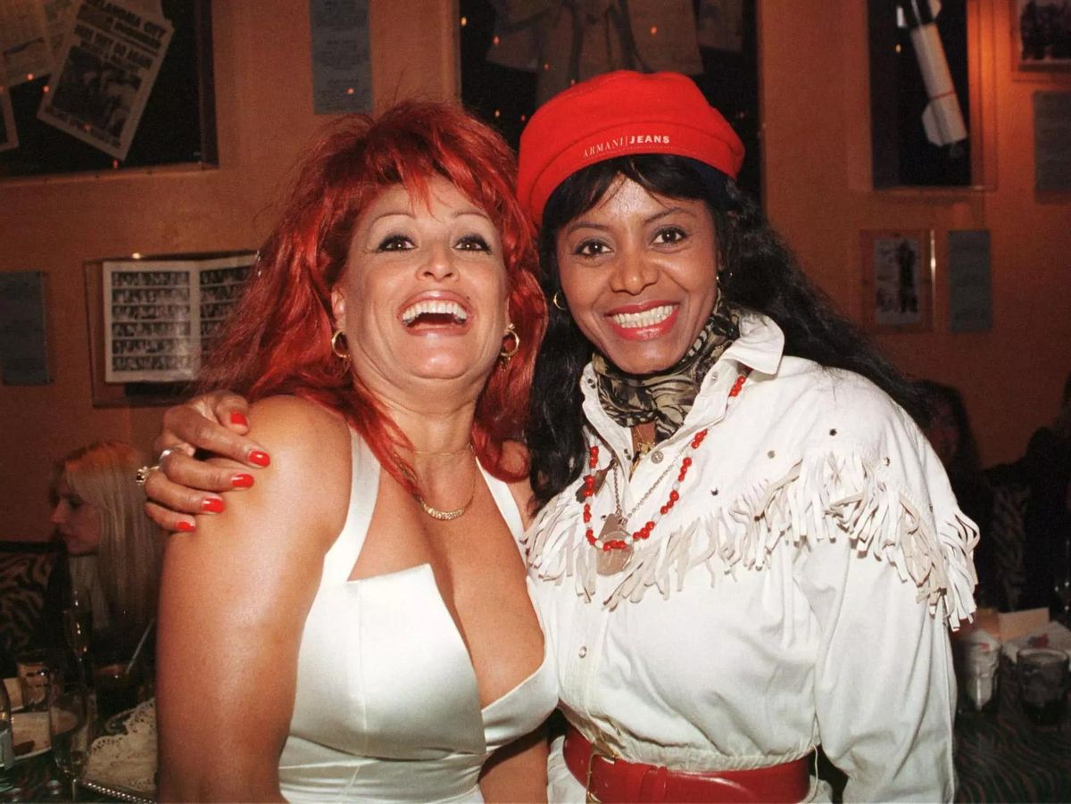 Regina Do Santos amb Aramis Fuster en una festa a Barcelona el 1998.