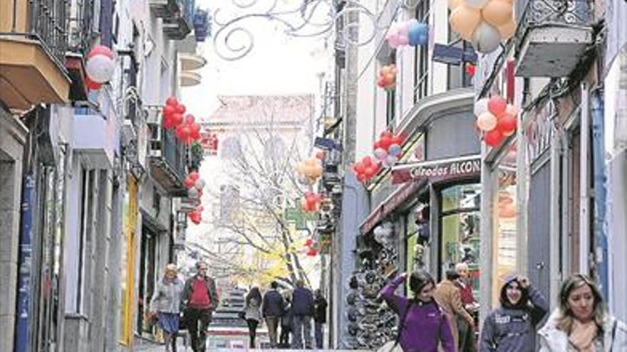 La calle Talavera celebra la Navidad con música, sorteos, regalos y Papá Noel