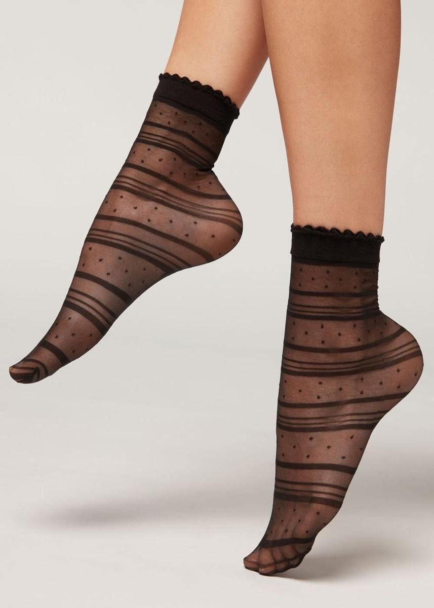 Calcetines transparentes negros con plumeti