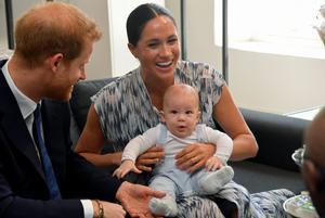 Britain’s Prince Harry and his wife Meghan, Duchess of Sussex, holding their son Archie, meet Archbishop Desmond Tutu at the Desmond & Leah Tutu Legacy Foundation in Cape Town, South Africa, September 25, 2019. REUTERS/Toby Melville/Pool