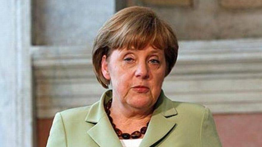 Merkel dice ante Rajoy que el Gobierno español debe responder del rescate