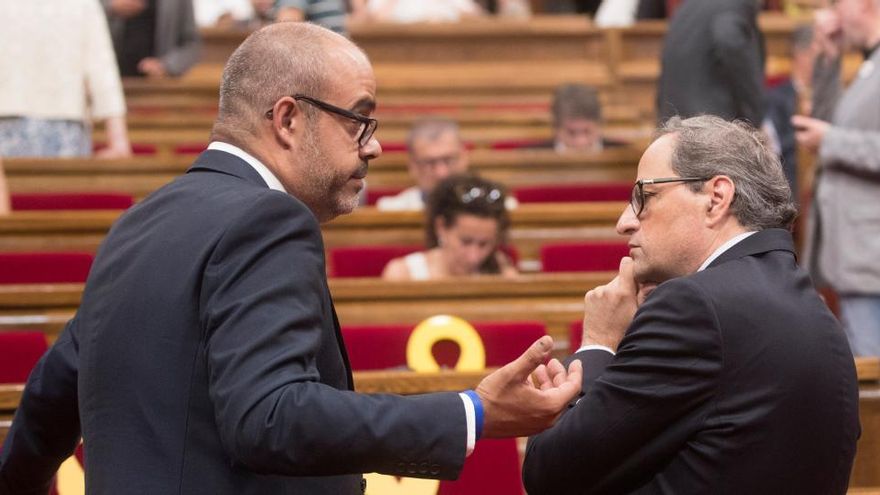 Quim Torra, junto a Miquel Buch.