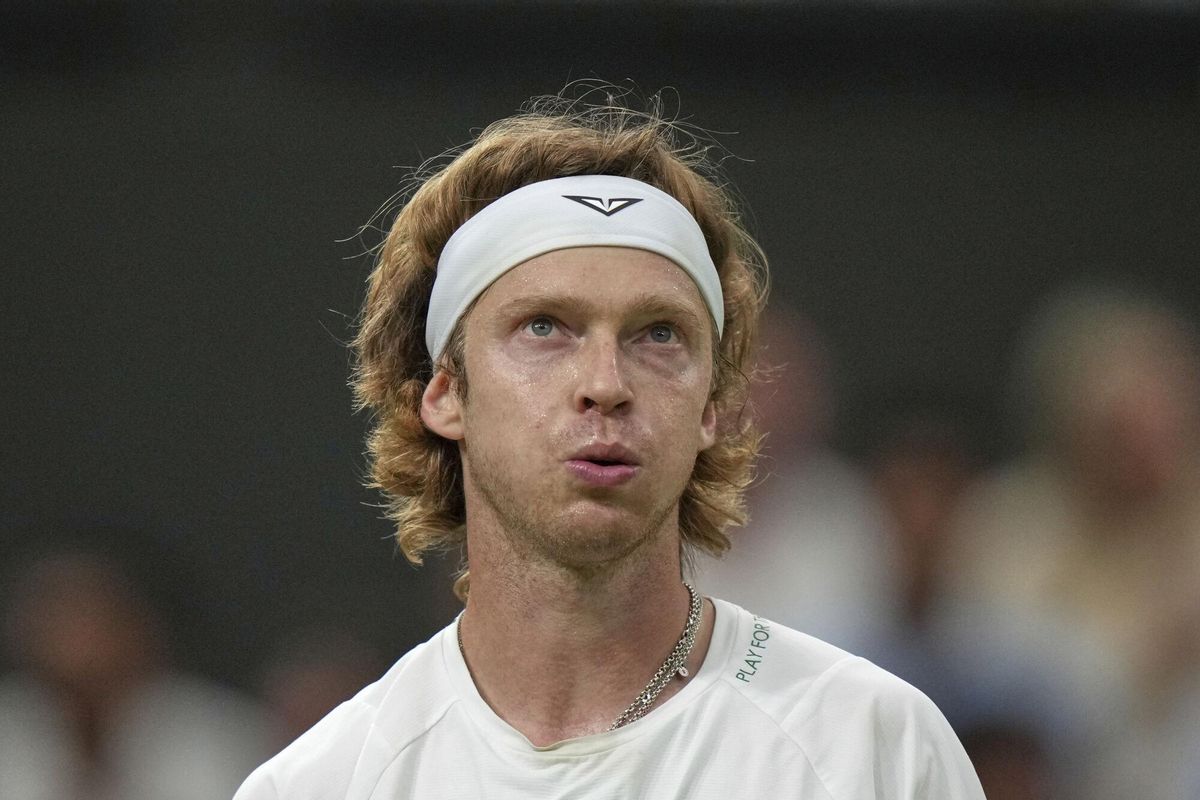 Russias Andrey Rublev reacts after losing a point against Spains Carlos Alcaraz during a fourth round mens singles match at the Wimbledon Tennis Championships in London, Sunday, July 6, 2025. (AP Photo/Alastair Grant)