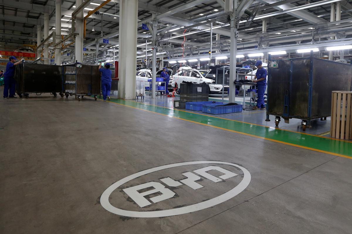 FILE PHOTO: A logo of BYD is painted inside an assembly line of the automobile maker in Shenzhen, China May 25, 2016.   REUTERS/Bobby Yip/File Photo