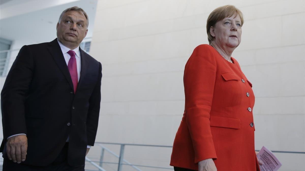 angela merkel  y victor orban