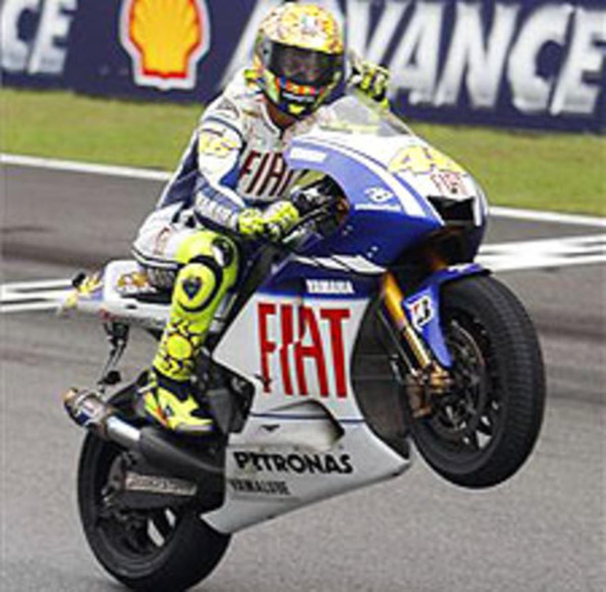 Rossi celebra el títol a la pista de Malàisia. Rossi celebra el títol a la pista de Malàisia.
