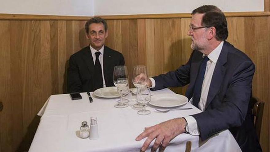 Rajoy invita a Sarkozy a un restaurante típico junto a Génova