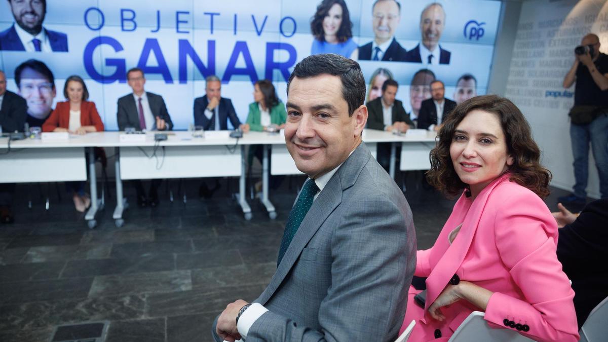 La presidenta de la Comunidad de Madrid, Isabel Díaz Ayuso, y el presidente de la Junta de Andalucía, Juanma Moreno.