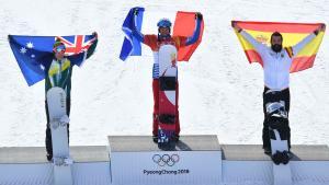 Snowboarding - Pyeongchang 2018 Winter Olympics - Menâ¿¿s Snowboard Cross Finals - Phoenix Snow Park - Pyeongchang, South Korea - February 15, 2018 -  Gold medalist Pierre Vaultier of France, silver medalist Jarryd Hughes of Australia and bronze medalist Regino Hernandez of Spain pose during the victory ceremony. REUTERS/Dylan Martinez