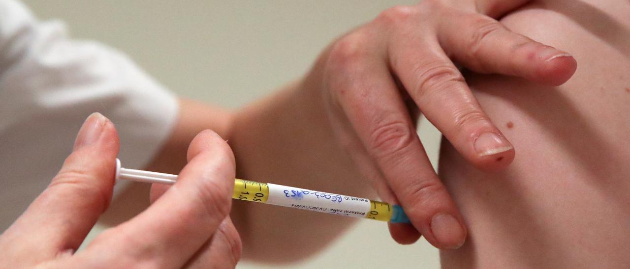 A volunteer receives a dose of CureVac vaccine or a placebo, in Brussels