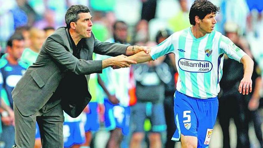 Muñiz con Luque, ayer en la Rosaleda.