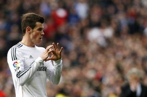Real Madrid's Bale celebrates his goal during their Spanish first division soccer match against Elche in Madrid