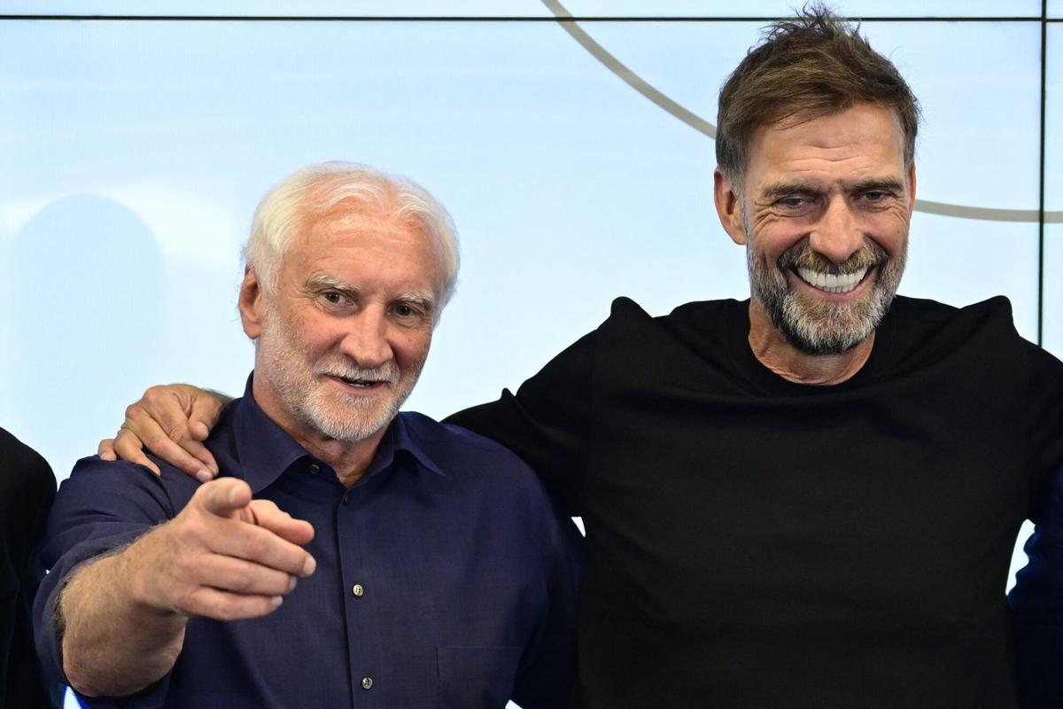 Director of Germany's national football team Rudi Voeller and Germany's newly appointed national football team head coach Juergen Klopp pose at the end of a press conference at the headquarters of the German Football Federation (DFB) in Frankfurt am Main, western Germany on July 24, 2026. Jurgen Klopp is widely expected to formally take over as the new head coach of the German men's national football team, with the German Football Association (DFB) calling a press conference for July 24, 2026. Klopp, famed for his success during stints as coach at Borussia Dortmund and especially Liverpool, has been in talks with the DFB about trying to lead Germany -- long a football powerhouse -- back to prominence. (Photo by John MACDOUGALL / AFP)