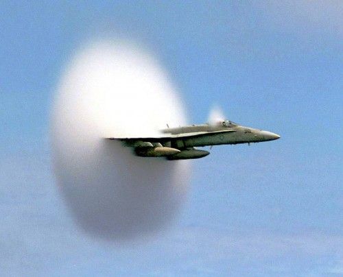 Handout file photo shows Lieutenant Ron Candiloro, assigned to Fighter Squadron One Five One, breaking the sound barrier in an F/A-18 Hornet fighter plane