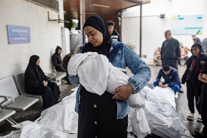 Palestinians mourn their dead at Al-Najjar Hospital in Rafah