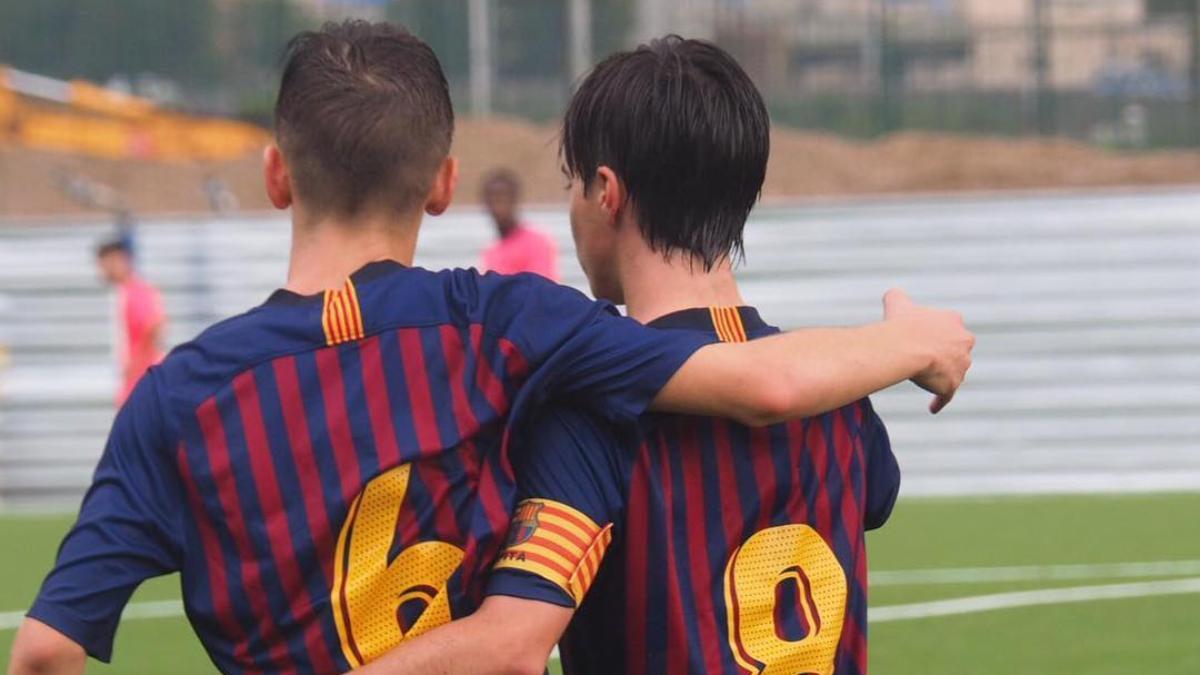 Jorge Alastuey se abraza con Marc Casadó