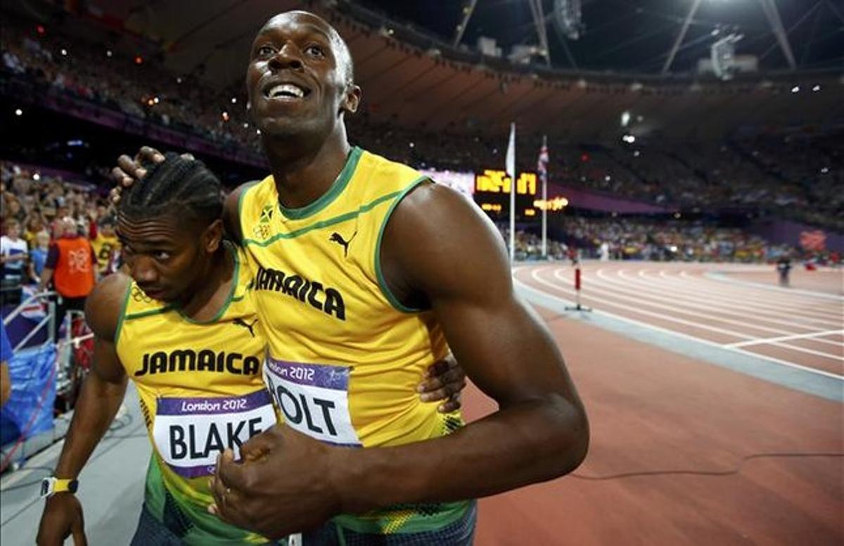 Bolt i Blake celebren el seu triomf en els 100 metres.