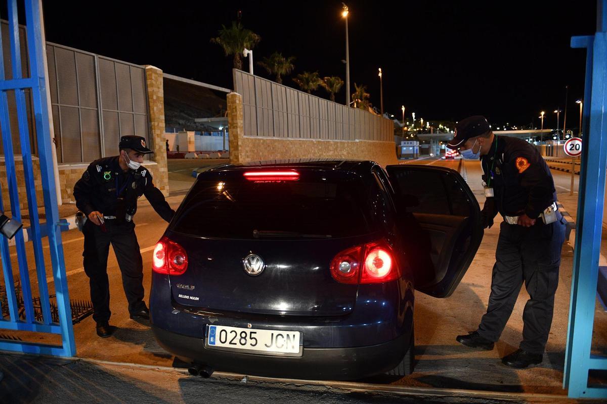 Ceuta (Spain), 17/05/2022.- People are stopped by authorities at a border crossing while leaving the Moroccan city of Fnidef, as seen from Ceuta, Spanish enclave in northern Africa, 17 May 2022. The border between Ceuta and Melilla and northern Africa were opened at midnight on Tuesday after a 26-month closure. (Marruecos, España) EFE/EPA/Jalal Morchidi