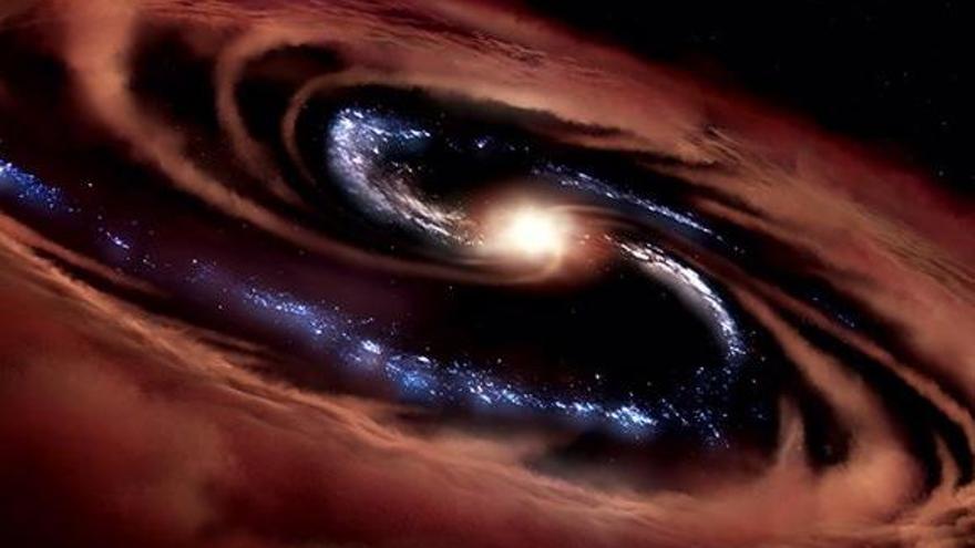 Una galaxia desafía teorías y sobrevive al festín de un agujero negro