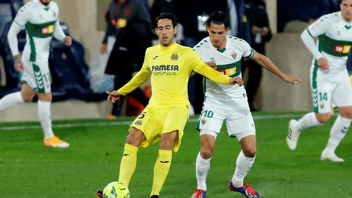 Pere Milla junto a Parejo.