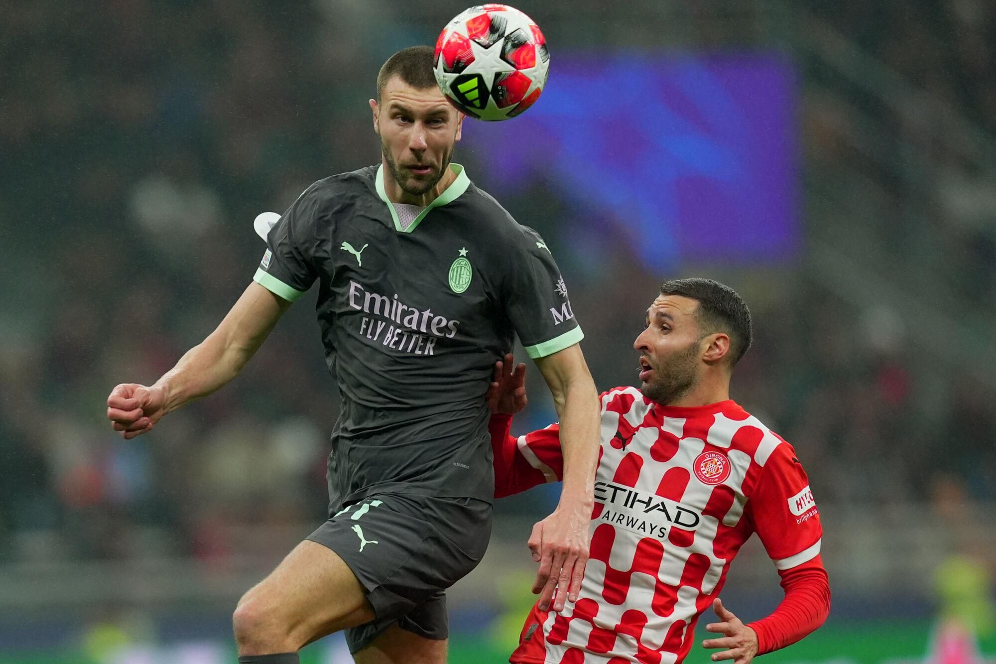 AC Milan's Strahinja Pavlovic fight for the ball with Girona's Abel Ruiz during the Uefa Champions League soccer match between Ac Milan and Girona at the San Siro Stadium in Milan, north Italy - Wednesday  , January 22, 2025. Sport - Soccer . (Photo by Spada/LaPresse)