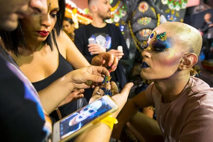 Participant prepares to perform in a drag queen ...