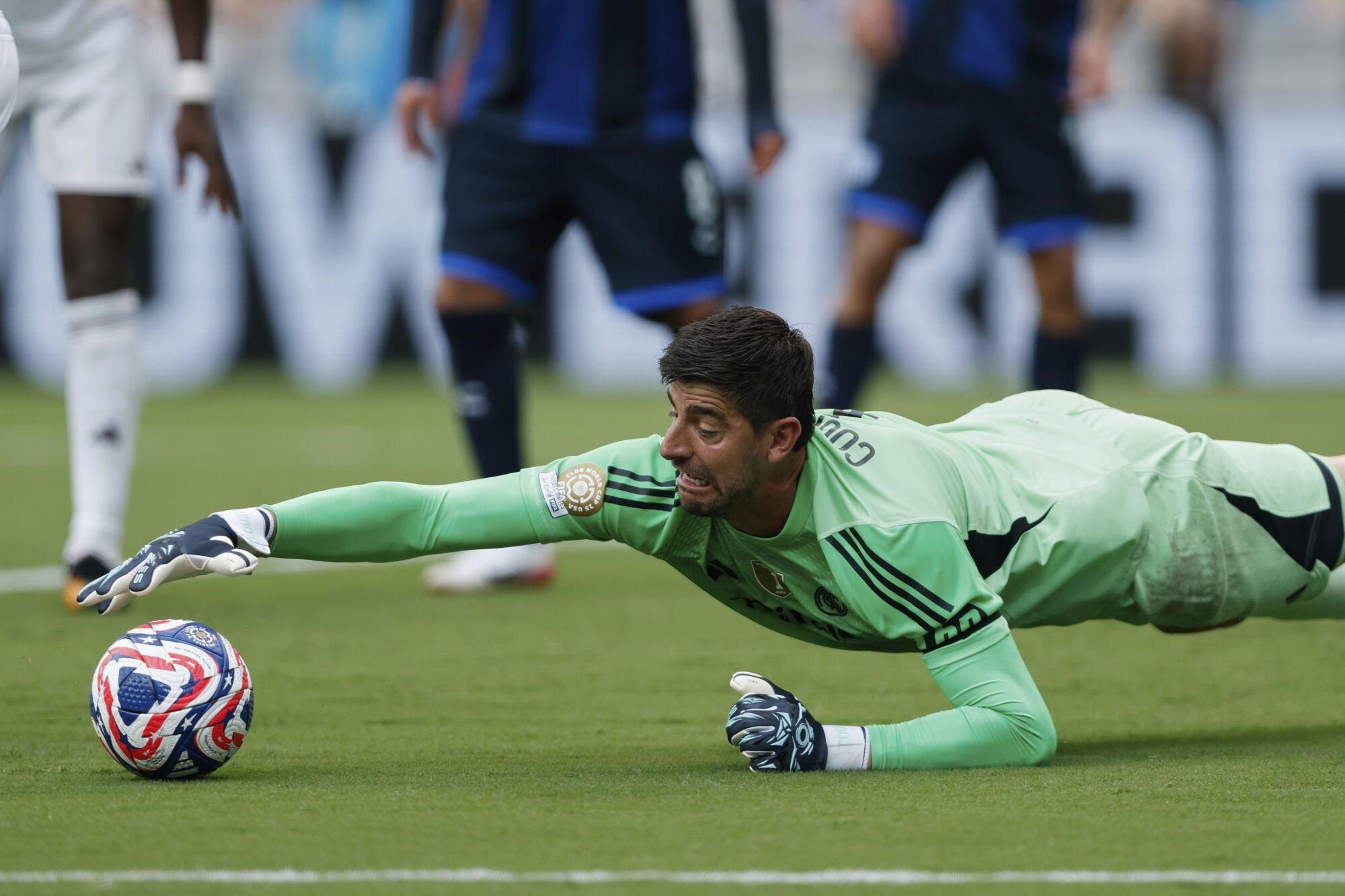 Real Madrid's Thibaut Courtois saves during the Club World Cup Group H soccer match between Real Madrid and CF Pachuca in Charlotte, N.C., Sunday, June 22, 2025. (AP Photo/Nell Redmond)