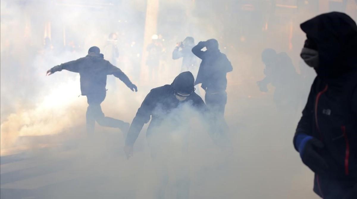 monmartinez38257044 youths battle through tear gas grenades during clashes part 170501175053