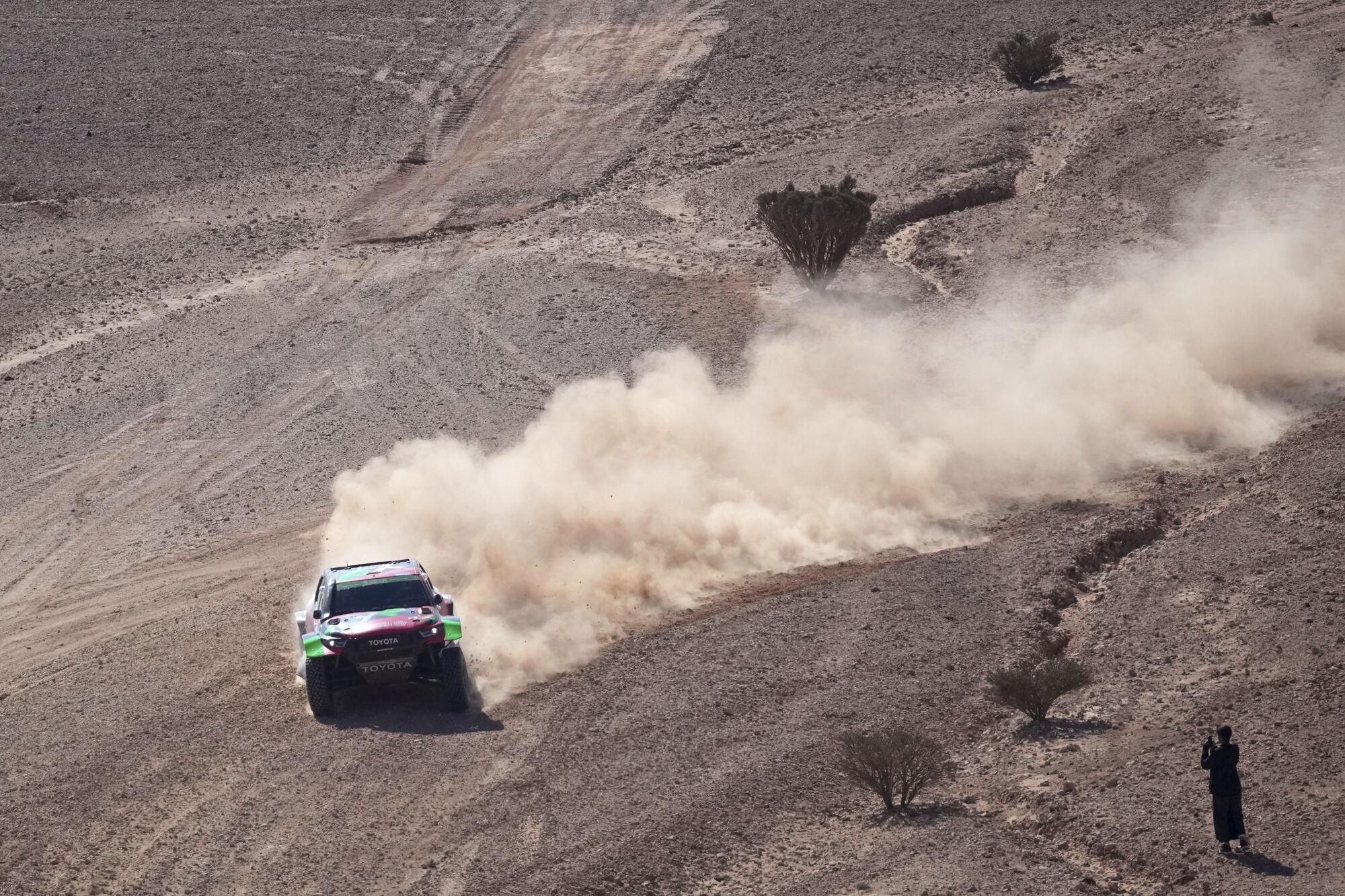 Driver Yazeed Al Rajhi and co-driver Timo Gottschalk compete during the ninth stage of the Dakar Rally between Riyadh and Haradh, Saudi Arabia, Tuesday, Jan. 14, 2025. (AP Photo/Christophe Ena)