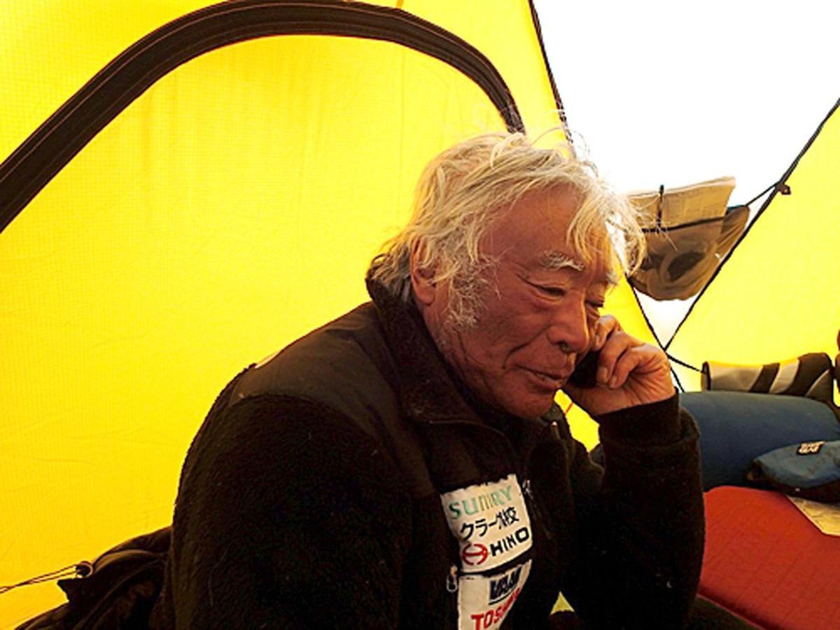 In this Tuesday, May 21, 2013, photo distributed by Miura Dolphins, 80-year-old Japanese extreme skier Yuichiro Miura rests in a camp at 8,000 meters (26,247 feet) during his attempt to scale the summit of Mount Everest. According to his management office, Miura plans to reach the 8,850-meter (29,035-foot) peak on Thursday, May 23 to be the world’s oldest person to climb the world’s highest peak. His rival, 81-year-old Min Bahadur Sherchan, from Nepal, who nabbed the record just before he could in 2008, was at the base camp preparing for his own attempt on the summit next week. (AP Photo/Miura Dolphins)  MANDATORY CREDIT