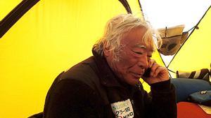 In this Tuesday, May 21, 2013, photo distributed by Miura Dolphins, 80-year-old Japanese extreme skier Yuichiro Miura rests in a camp at 8,000 meters (26,247 feet) during his attempt to scale the summit of Mount Everest. According to his management office, Miura plans to reach the 8,850-meter (29,035-foot) peak on Thursday, May 23 to be the world’s oldest person to climb the world’s highest peak. His rival, 81-year-old Min Bahadur Sherchan, from Nepal, who nabbed the record just before he could in 2008, was at the base camp preparing for his own attempt on the summit next week. (AP Photo/Miura Dolphins)  MANDATORY CREDIT