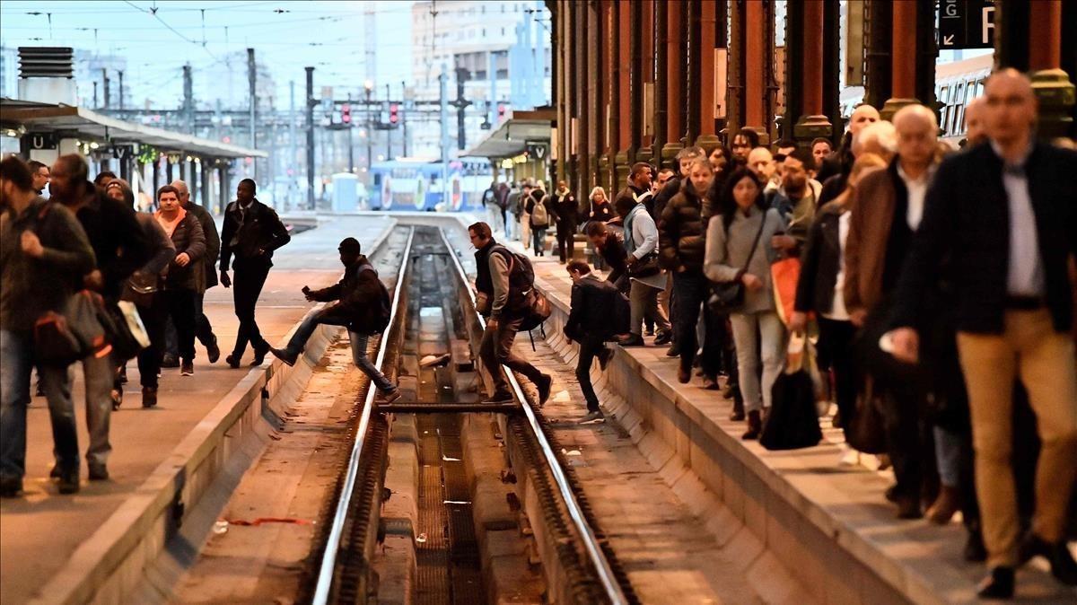 undefined42759062 people cross railtracks in a station in paris on april 3  20180403173822