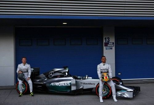 Mercedes Formula One racing driver Hamilton of Britain and teammate Rosberg of Germany unveil the new Mercedes F1 W05 car at the Jerez racetrack in southern Spain