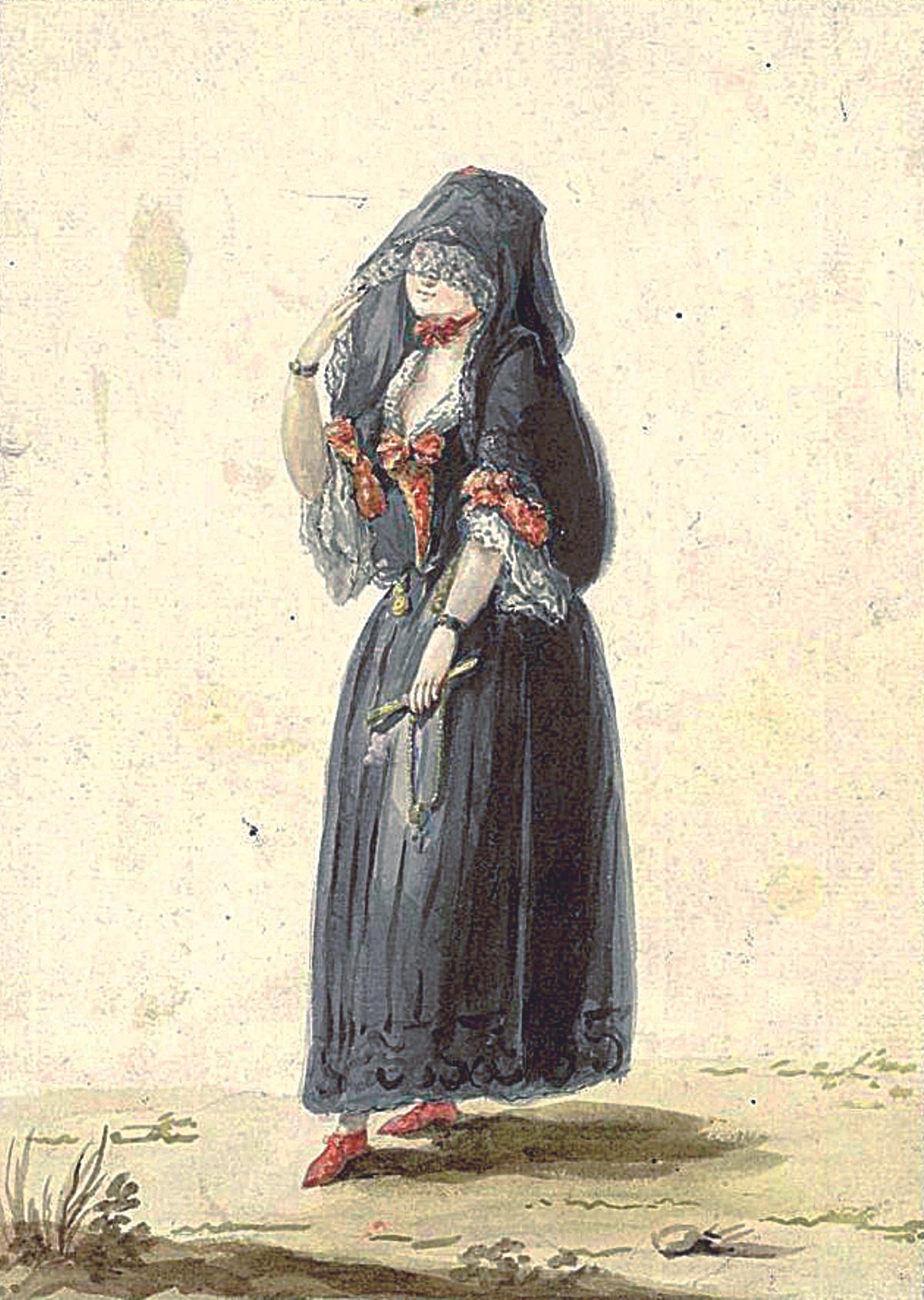 PETIMETRA ESPAÑOLA. UNA MUJER CON MANTO CON MOTIVO DE LA LA SEMANA SANTA, UNA ILUSTRACIÓN HABITUAL QUE YA APARECE EN EL SIGLO XVIII. LA IMAGEN PERTENECE AL ARCHIVO MAUVESÍN