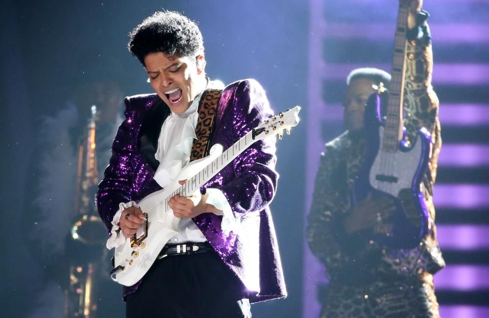 Bruno Mars performs "Let's Go Crazy" during a ...